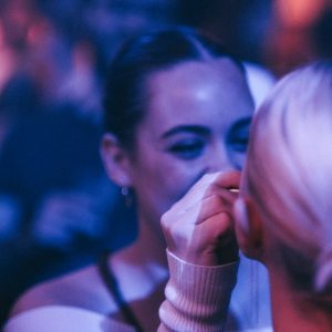 a couple of women standing next to each other